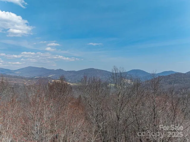a view of mountains and valleys