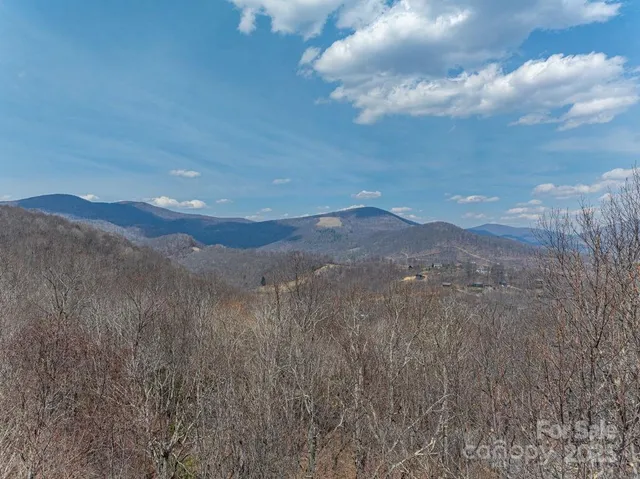 a view of mountain view with mountains in the background
