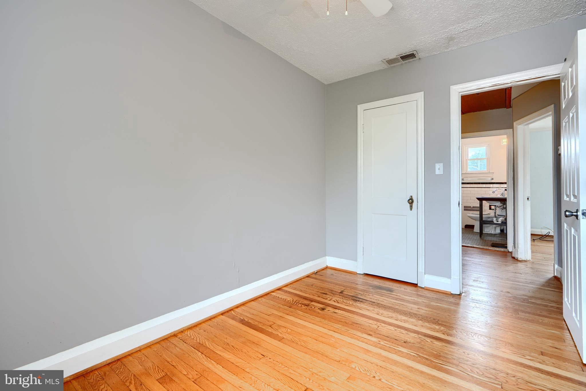 56 Yorkway Baltimore, MD 21222 - Photo 24 of 34 a view of empty room with wooden floor