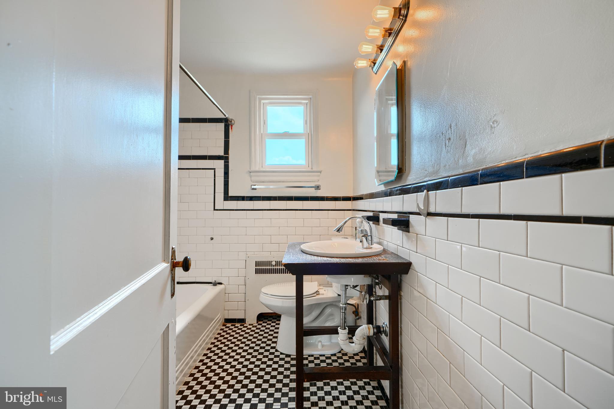 56 Yorkway Baltimore, MD 21222 - Photo 26 of 34 a bathroom with a sink and a mirror