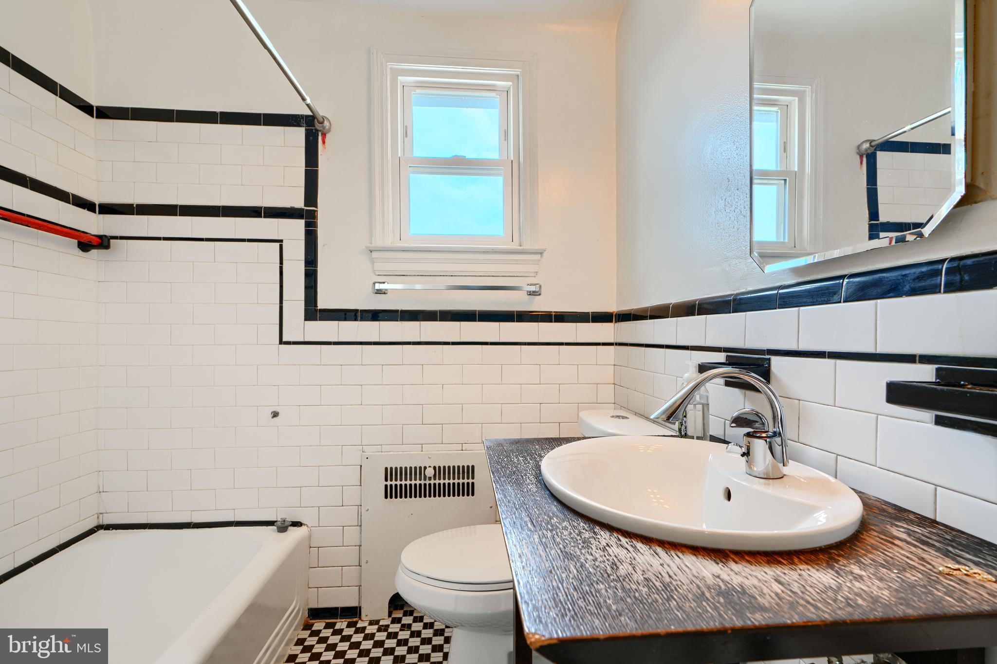 56 Yorkway Baltimore, MD 21222 - Photo 27 of 34 a bathroom with a sink and a mirror