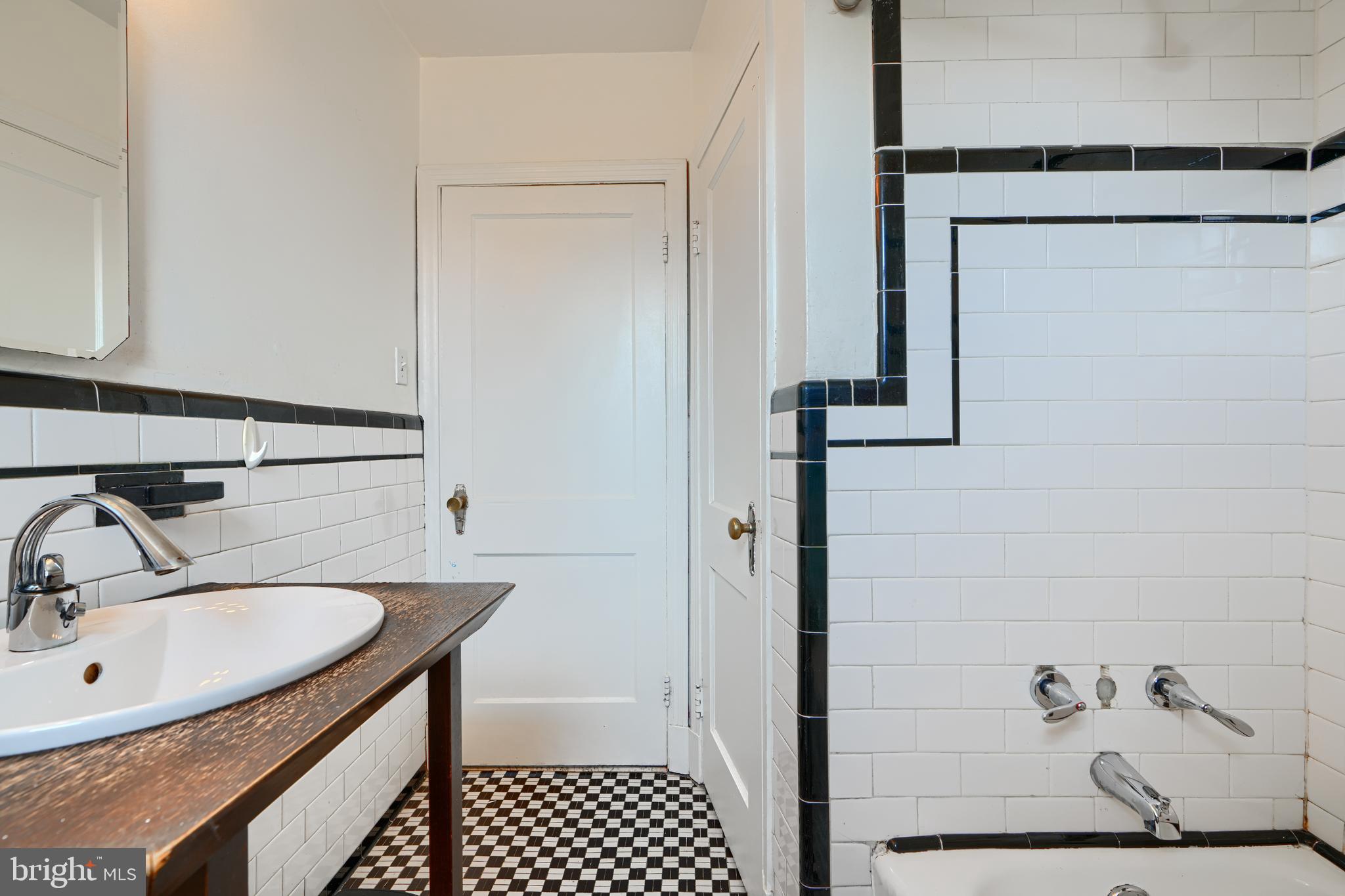 56 Yorkway Baltimore, MD 21222 - Photo 28 of 34 a bathroom with a sink and a mirror