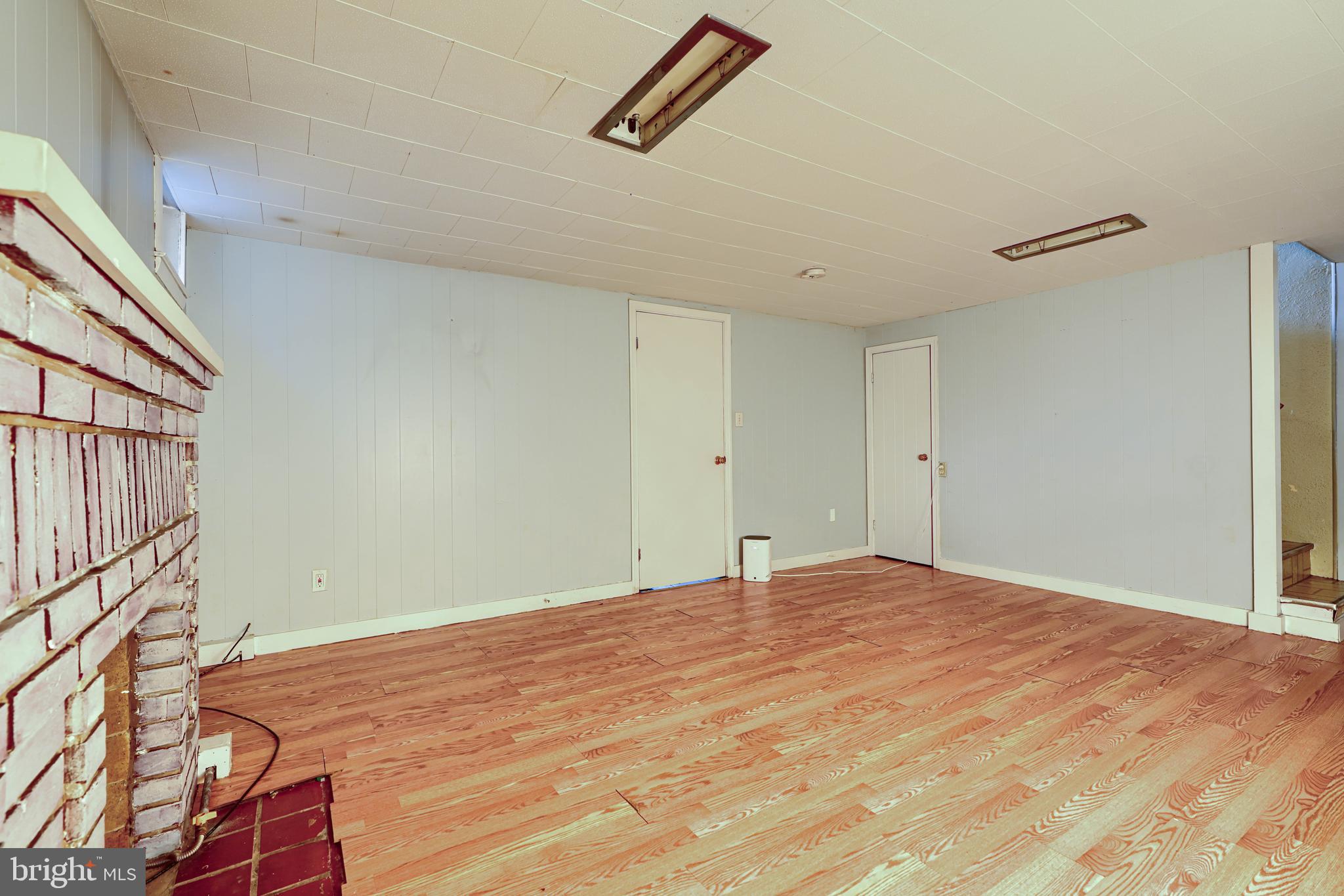 56 Yorkway Baltimore, MD 21222 - Photo 30 of 34 a view of empty room with wooden floor and fan