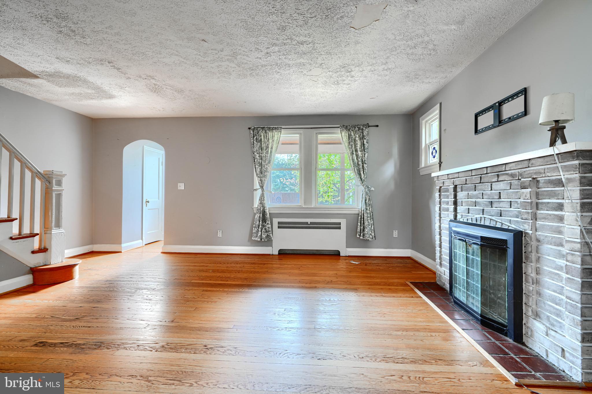 56 Yorkway Baltimore, MD 21222 - Photo 7 of 34 a view of an empty room with window and fireplace