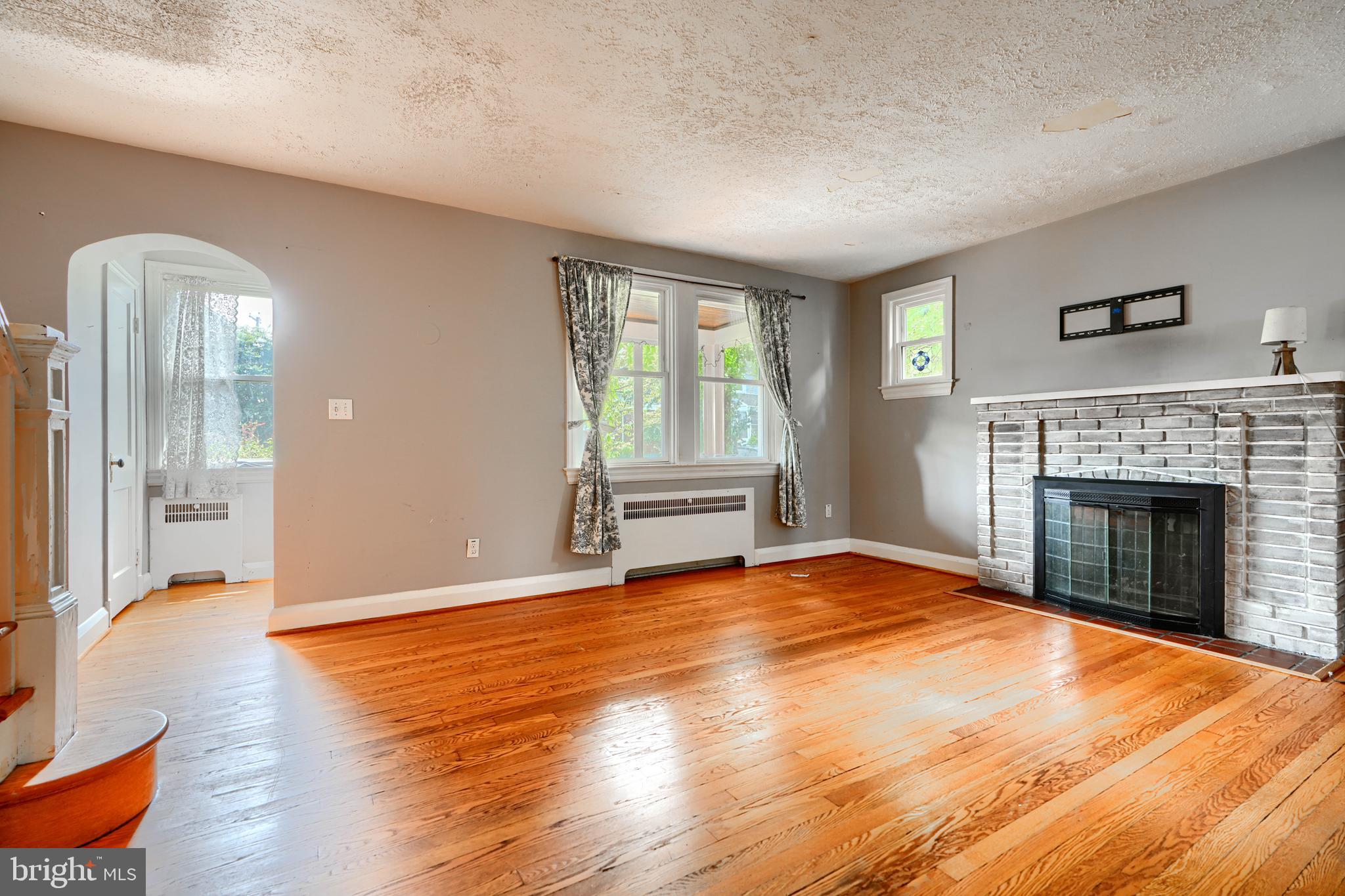 56 Yorkway Baltimore, MD 21222 - Photo 8 of 34 a view of an empty room with window and fire place