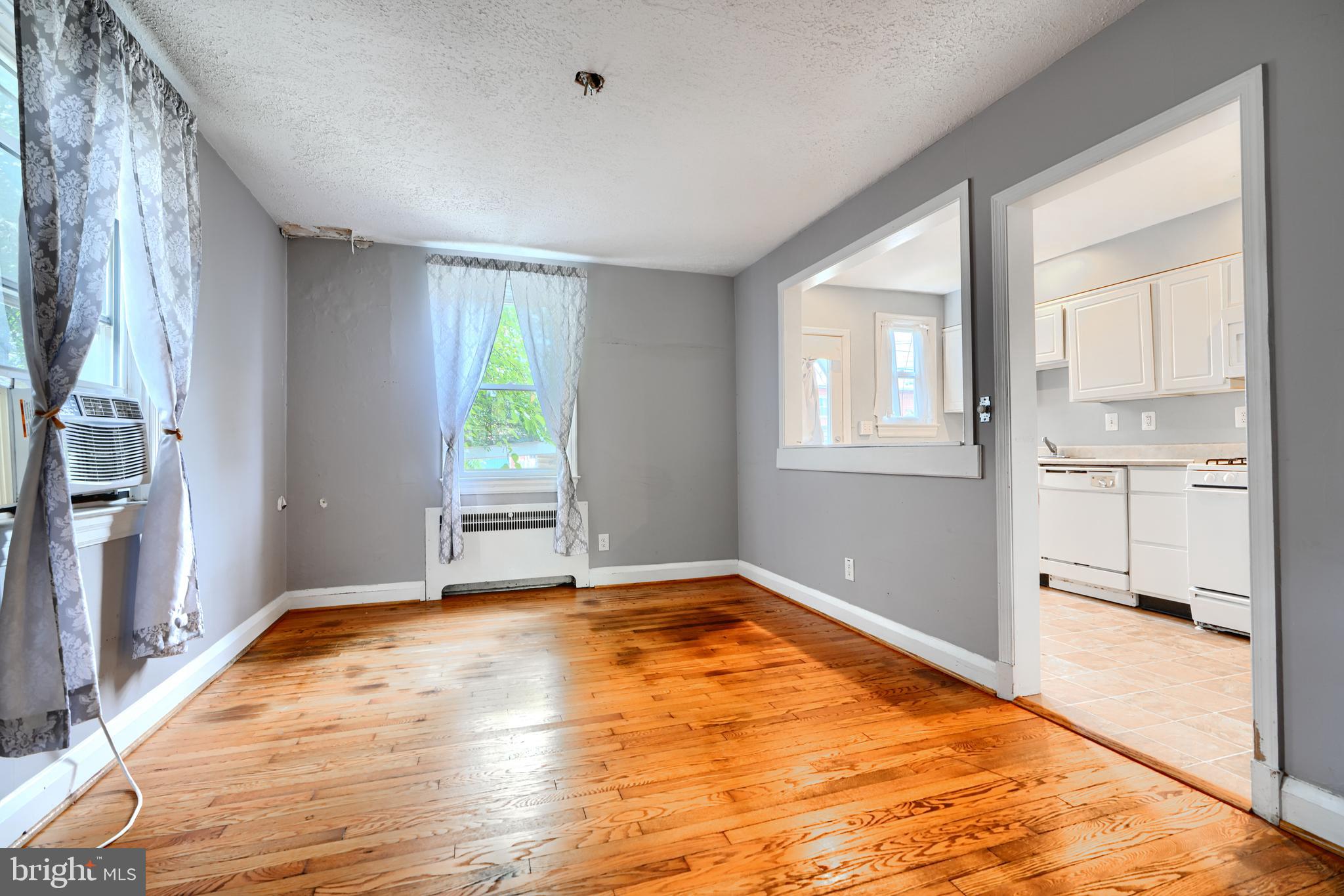56 Yorkway Baltimore, MD 21222 - Photo 9 of 34 a view of an empty room with window and wooden floor