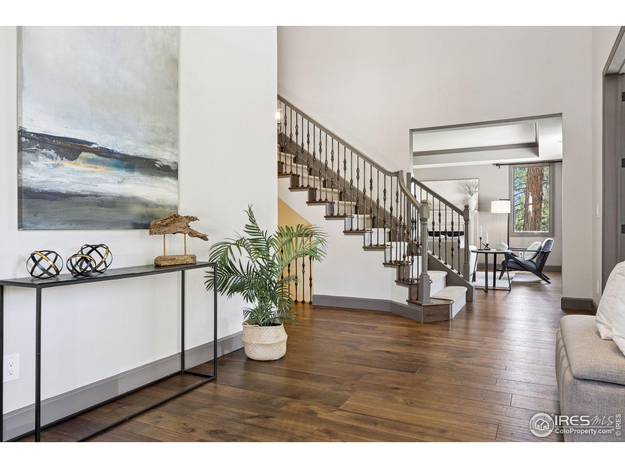 65 Indigo Way Castle Rock, CO 80108 - Photo 2 of 50 a view of entryway and hall with wooden floor