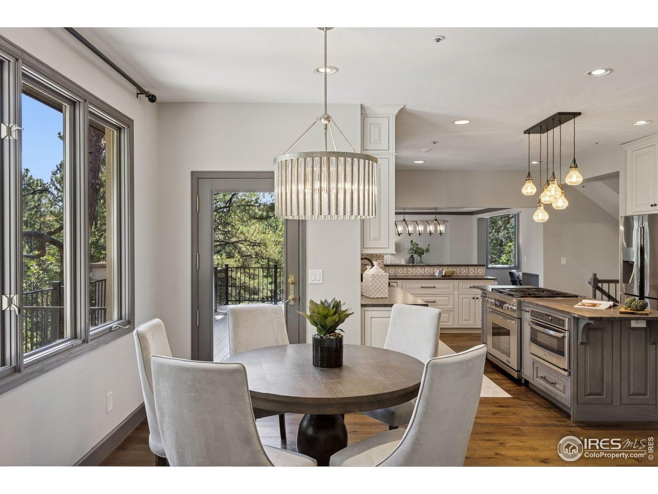 65 Indigo Way Castle Rock, CO 80108 - Photo 22 of 50 a view of a dining room with furniture window and wooden floor