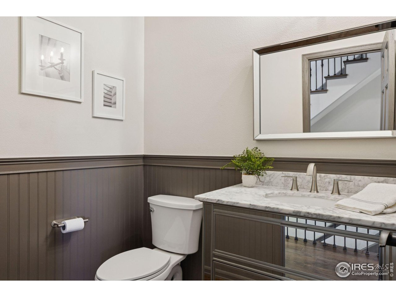 65 Indigo Way Castle Rock, CO 80108 - Photo 27 of 50 a bathroom with a sink a toilet and mirror