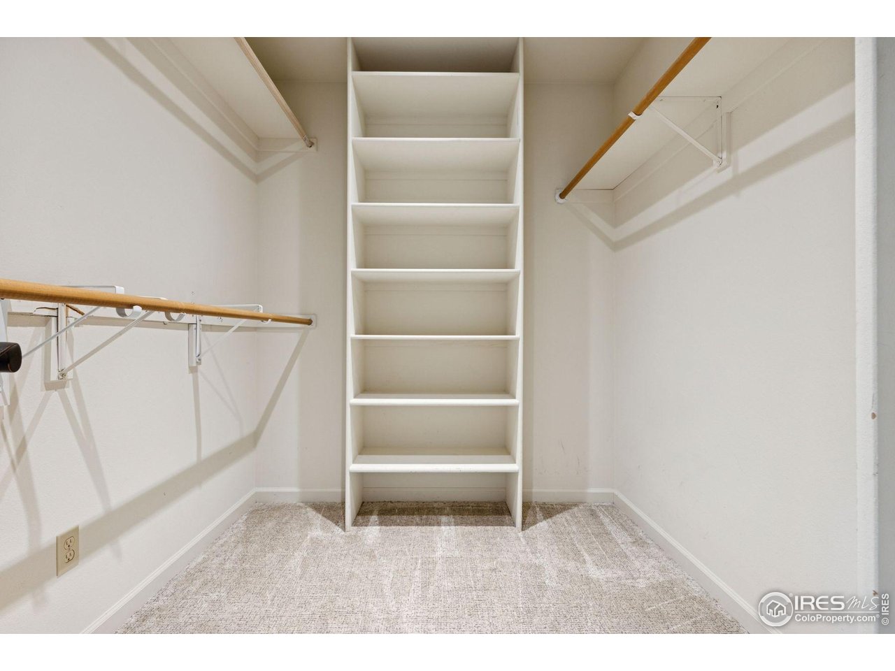 65 Indigo Way Castle Rock, CO 80108 - Photo 30 of 50 a view of an empty room with wooden floor and stairs