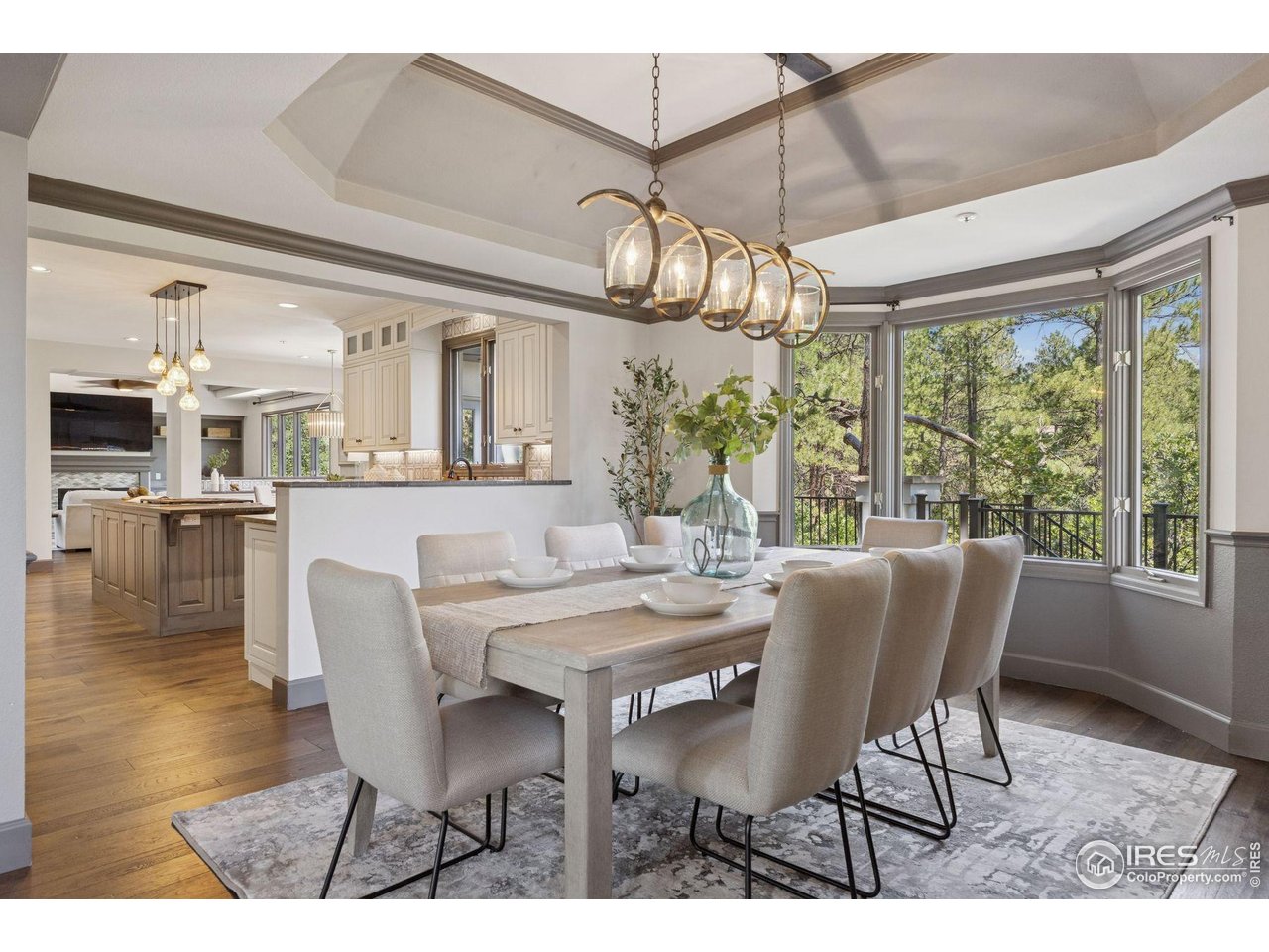65 Indigo Way Castle Rock, CO 80108 - Photo 8 of 50 a view of a dining room with furniture wooden floor and chandelier