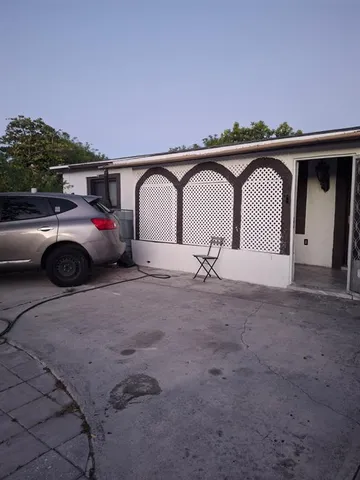 a front view of a house with parking space