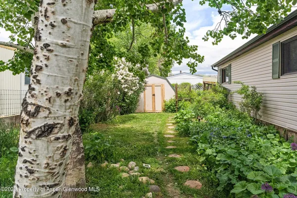 a backyard of a house with lots of green space