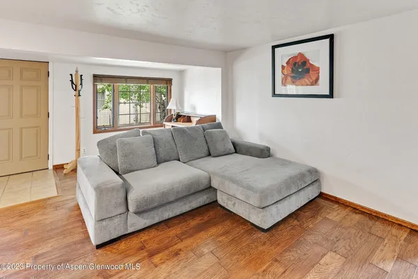 a living room with furniture and window