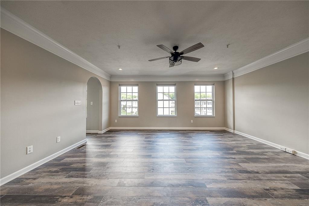 131 Rylie Drive Harmony, PA 16037 - Photo 13 of 34 a view of an empty room with wooden floor and a window