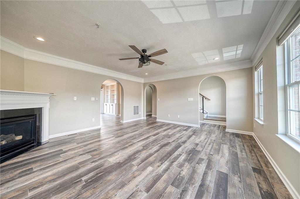131 Rylie Drive Harmony, PA 16037 - Photo 15 of 34 a view of empty room with wooden floor and fireplace
