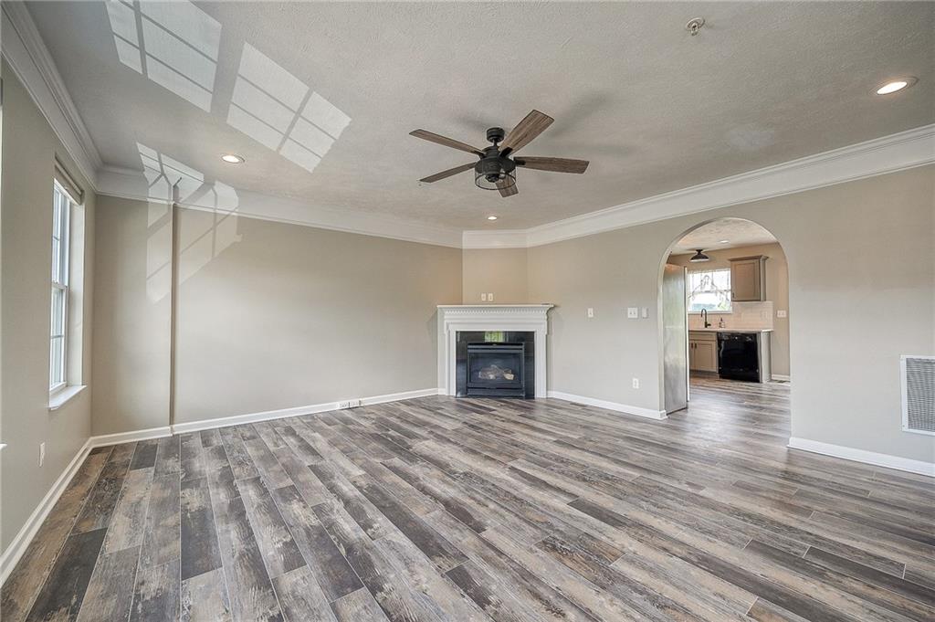 131 Rylie Drive Harmony, PA 16037 - Photo 17 of 34 a view of empty room with wooden floor and fireplace