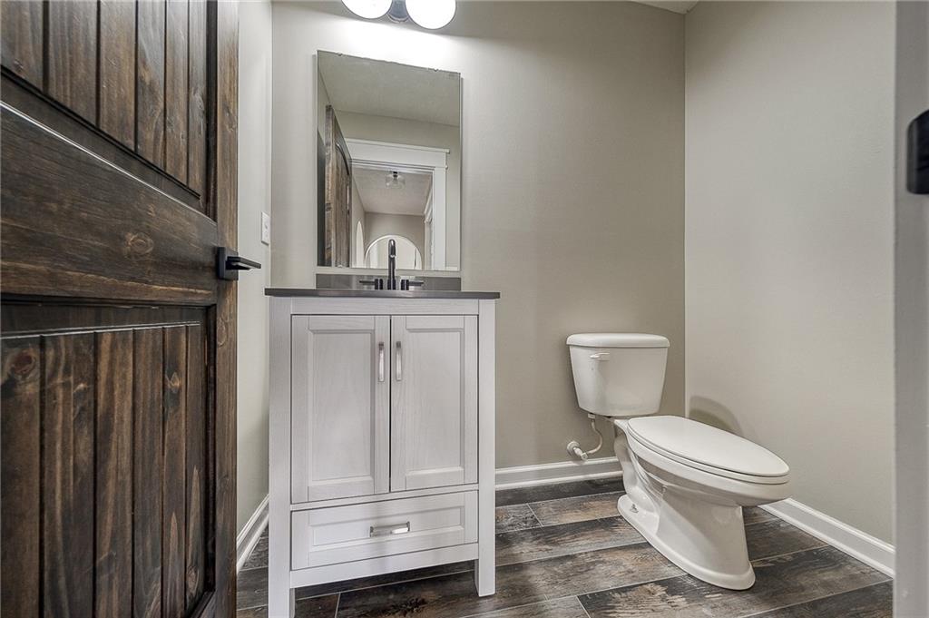 131 Rylie Drive Harmony, PA 16037 - Photo 19 of 34 a bathroom with a toilet a sink and mirror