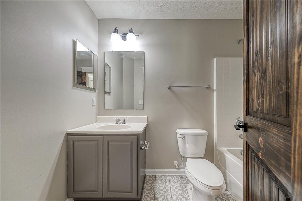 131 Rylie Drive Harmony, PA 16037 - Photo 20 of 34 a bathroom with a toilet a sink and mirror