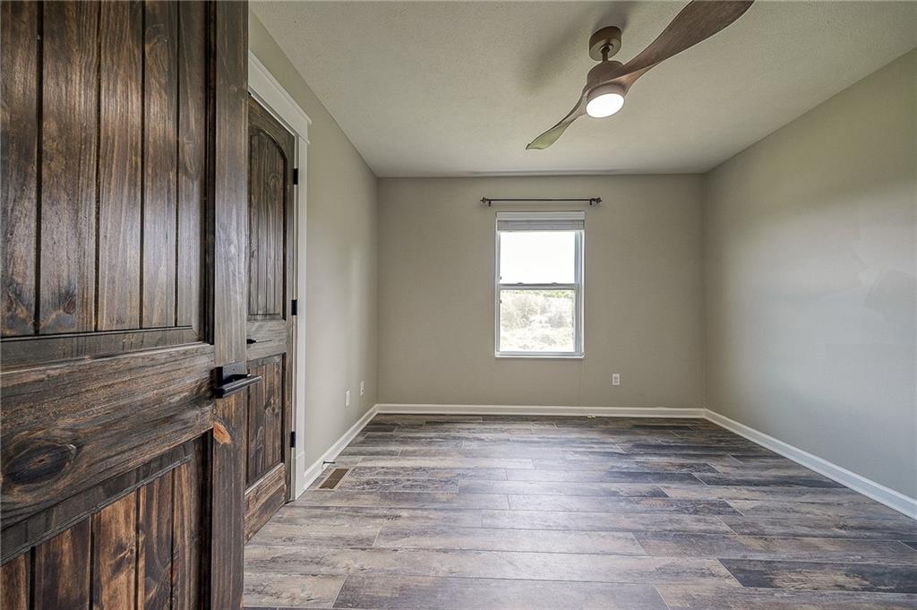 131 Rylie Drive Harmony, PA 16037 - Photo 22 of 34 an empty room with wooden floor and windows