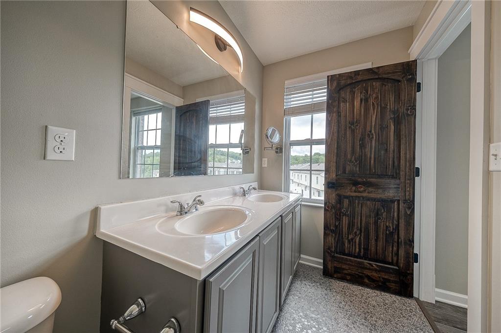 131 Rylie Drive Harmony, PA 16037 - Photo 28 of 34 a bathroom with 2 sink and a toilet