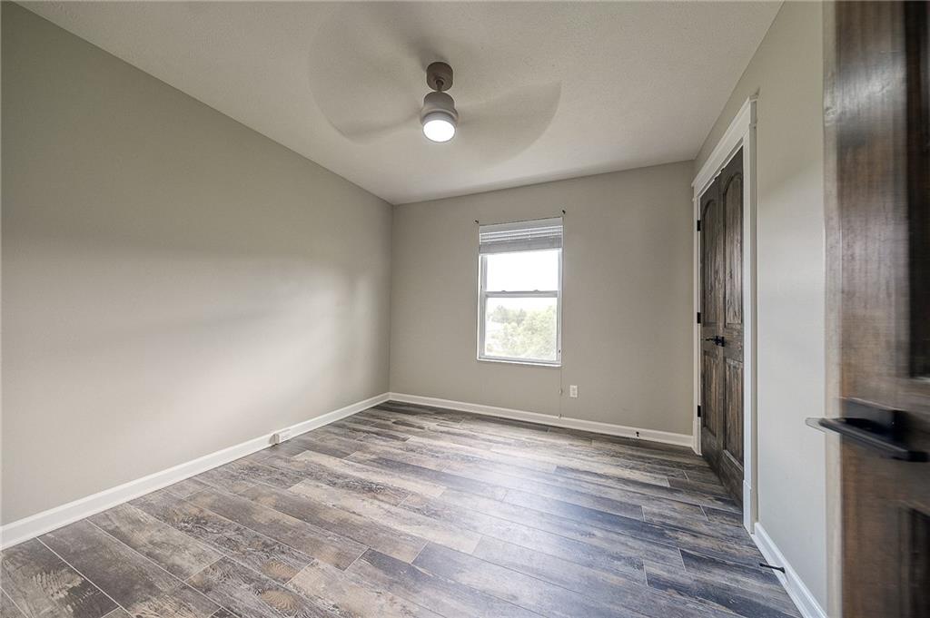 131 Rylie Drive Harmony, PA 16037 - Photo 29 of 34 a view of empty room with wooden floor and fan