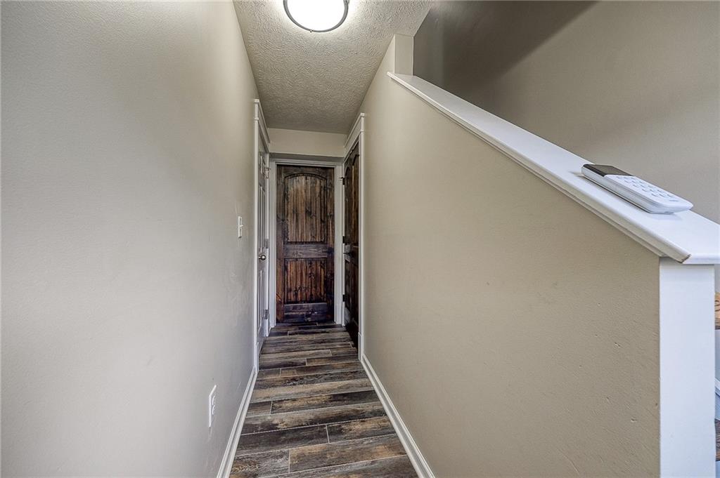 131 Rylie Drive Harmony, PA 16037 - Photo 4 of 34 a view of a hallway with wooden floor and staircase