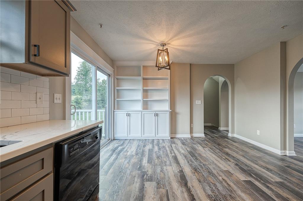 131 Rylie Drive Harmony, PA 16037 - Photo 9 of 34 a view of a kitchen with wooden floor and a sink