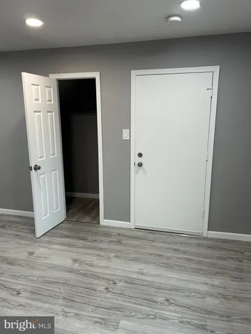 a view of entryway with wooden floor