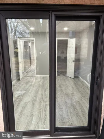 a view of a glass door and a window