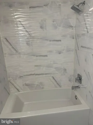 a close up of a bathtub in a bathroom
