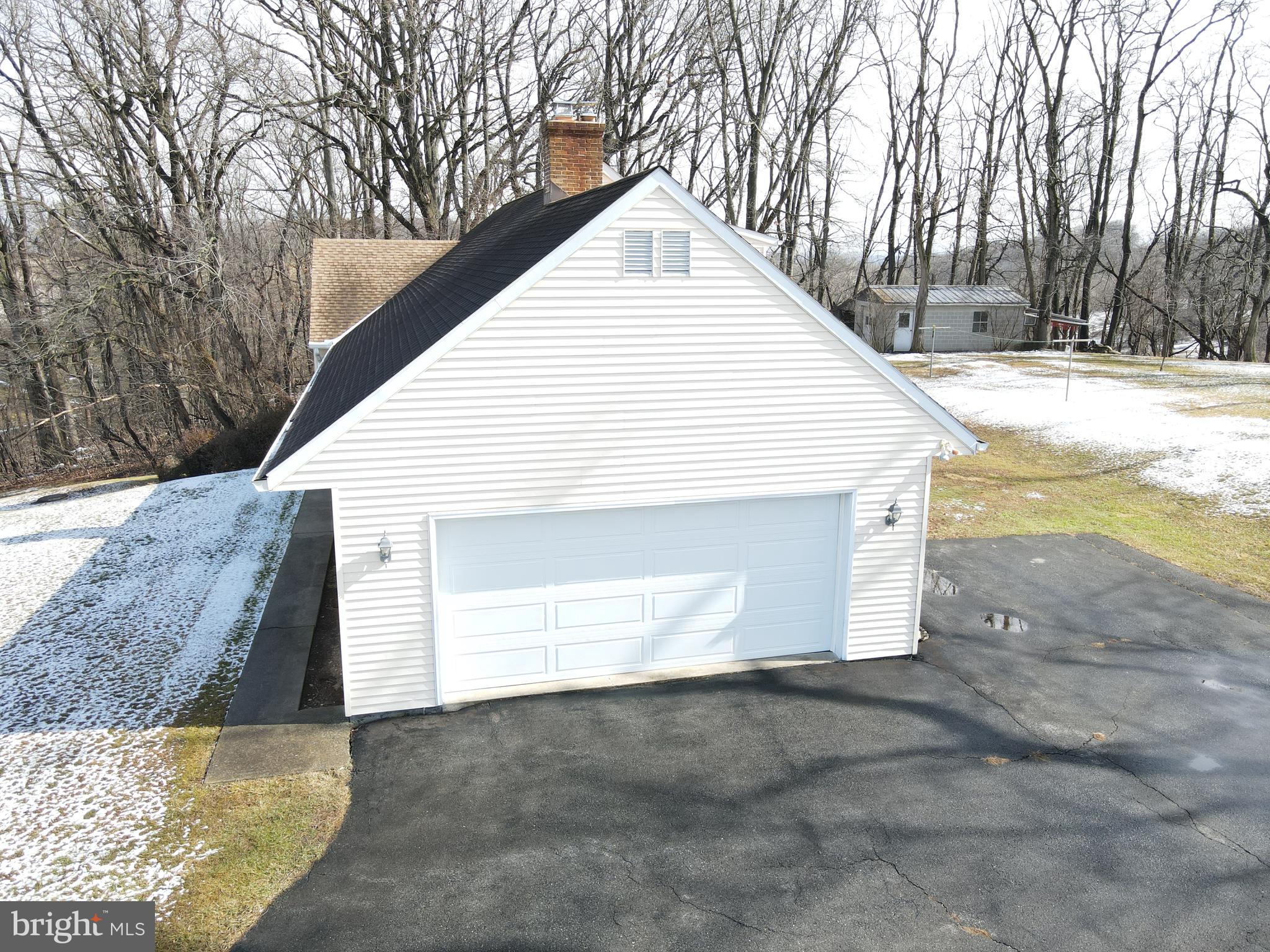 236 Pittsburg Valley Road Conestoga, PA 17516 - Photo 59 of 75 a view of a white house with a yard covered in snow