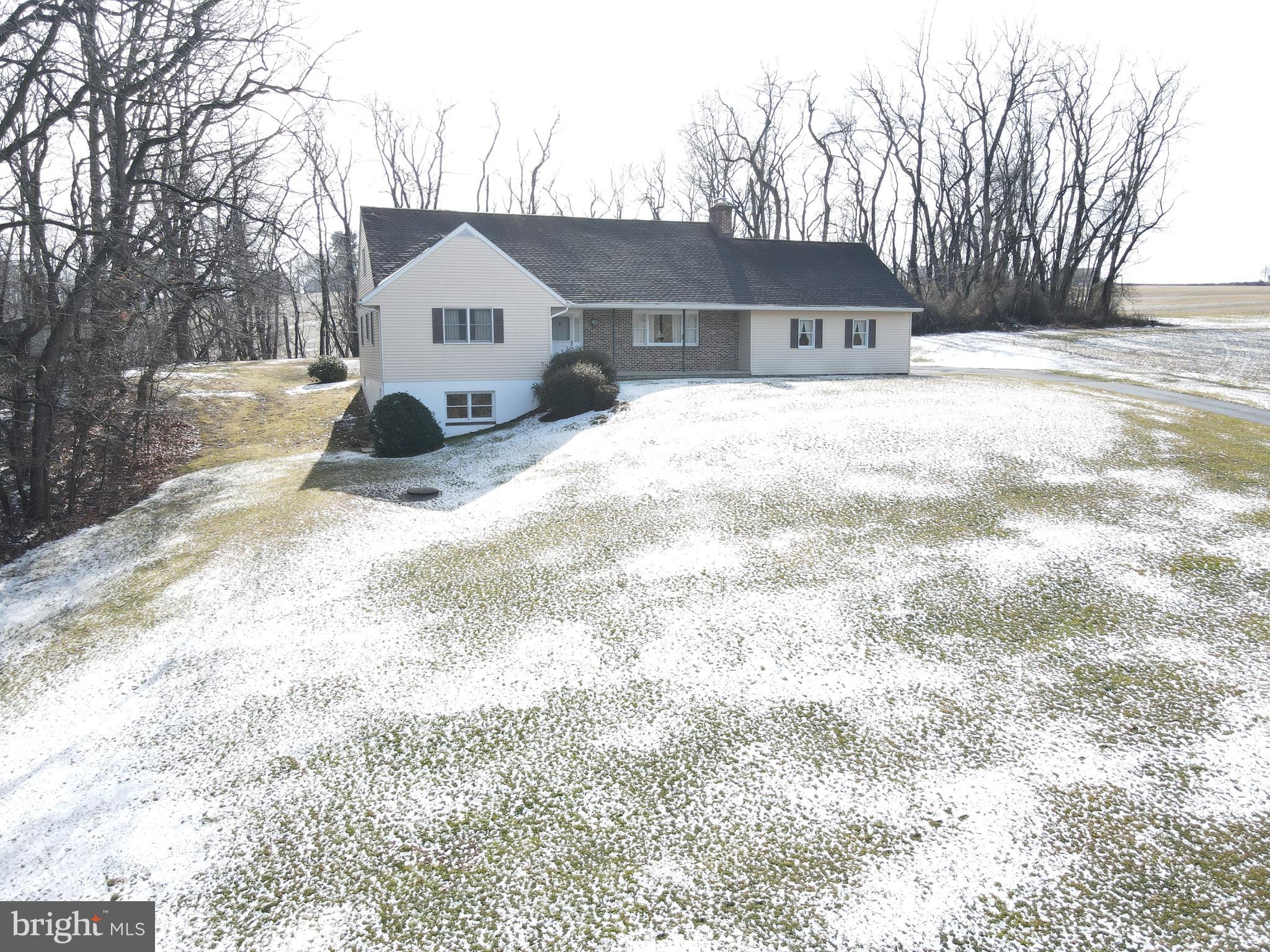 236 Pittsburg Valley Road Conestoga, PA 17516 - Photo 74 of 75 a front view of a house with a yard covered in snow