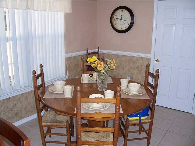 4445 Antioch Road Crestview, FL 32536 - Photo 5 of 10 a view of a dining room with furniture and a window