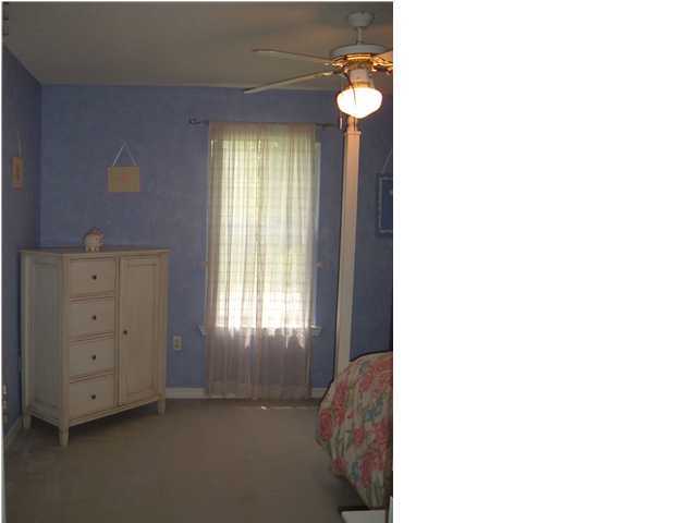 4445 Antioch Road Crestview, FL 32536 - Photo 10 of 10 a view of an empty room with windows