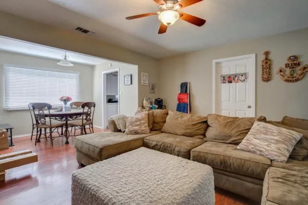 a living room with furniture and a large window