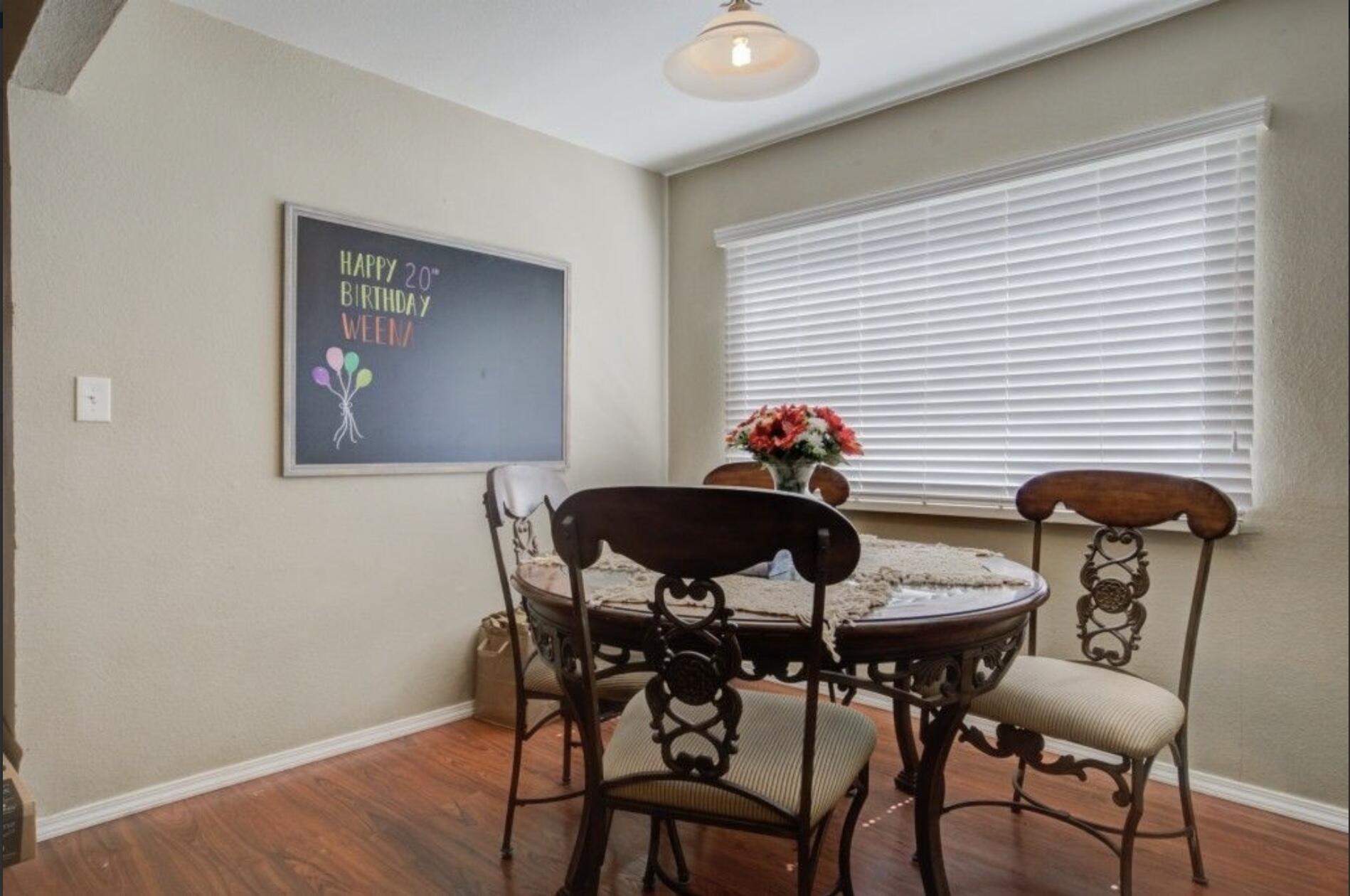 3815 31st Street Lubbock, TX 79410 - Photo 11 of 22 a view of a dining room with furniture and wooden floor