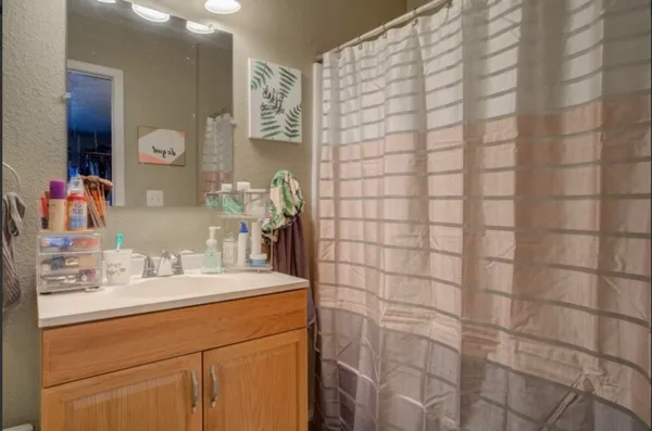 a bathroom with a sink and a mirror
