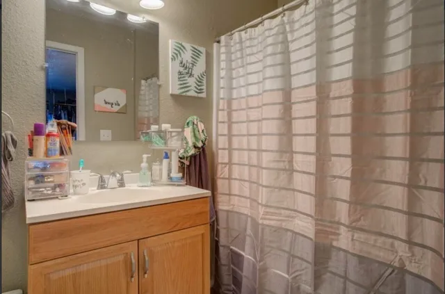 a bathroom with a sink and a mirror