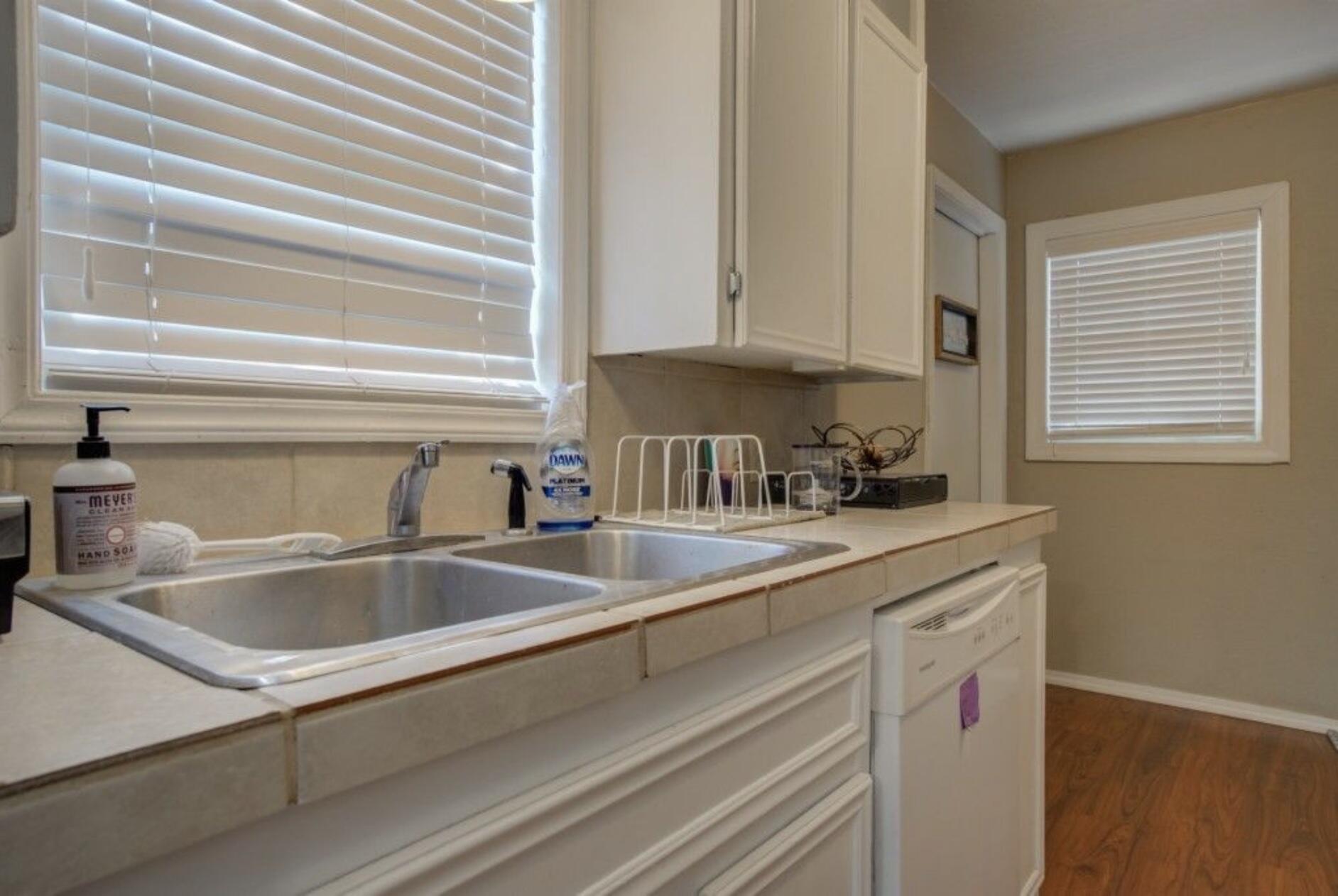 3815 31st Street Lubbock, TX 79410 - Photo 16 of 22 a kitchen with sink and cabinets