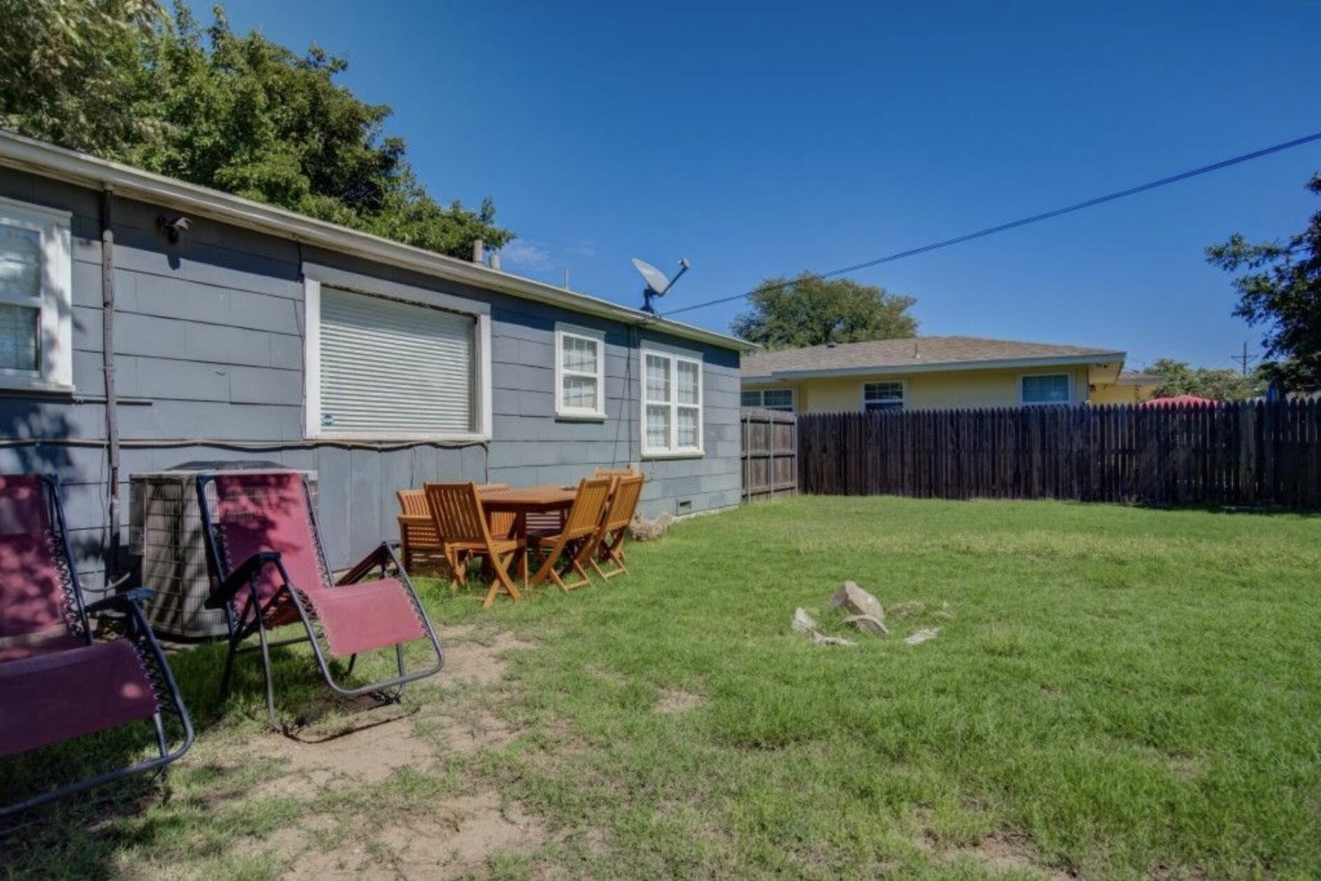 3815 31st Street Lubbock, TX 79410 - Photo 20 of 22 a view of a backyard with a large tree