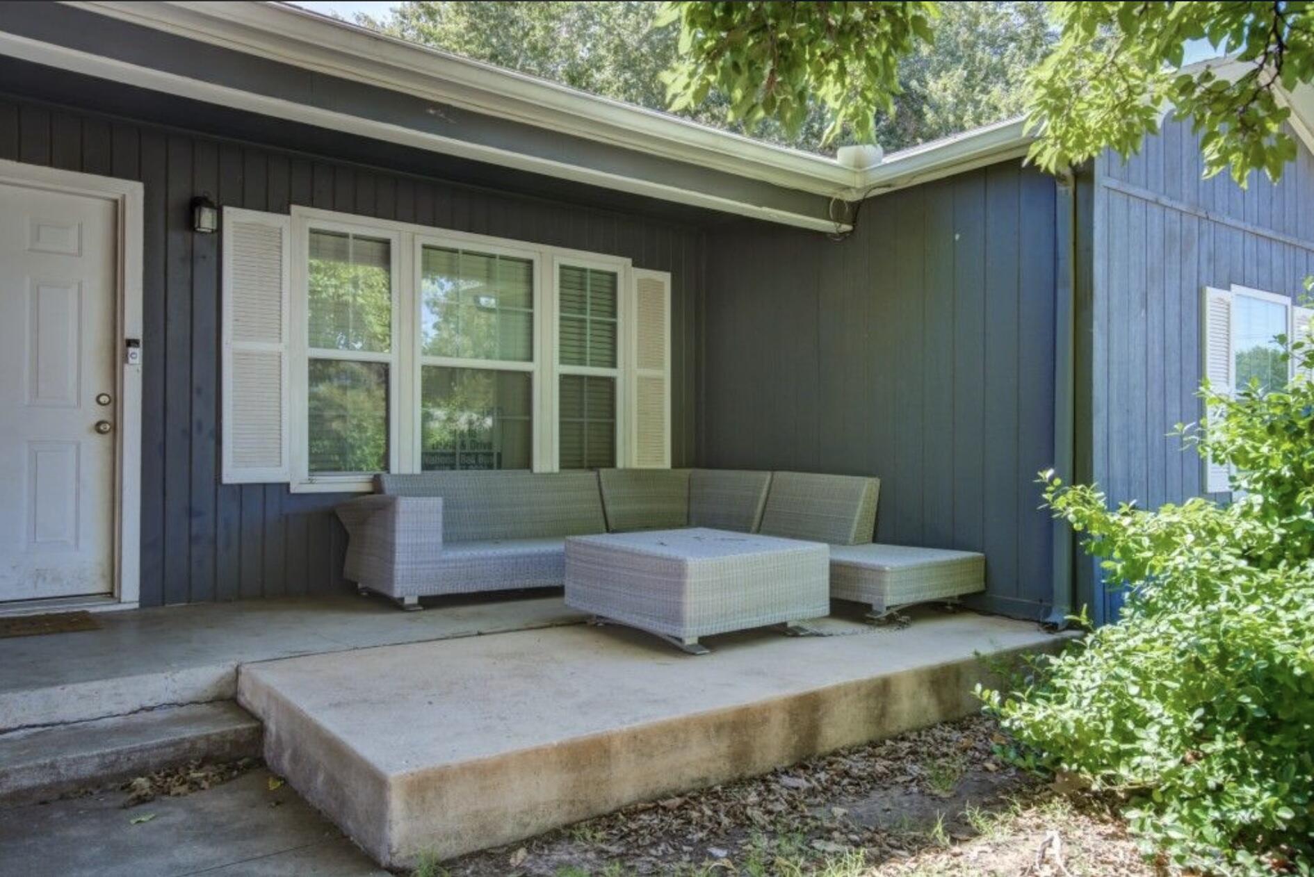 3815 31st Street Lubbock, TX 79410 - Photo 2 of 22 a living room with a couch and a potted plant