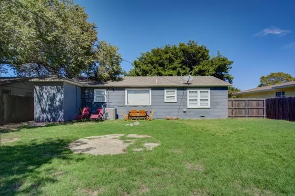 a front view of house with yard outdoor seating and green space