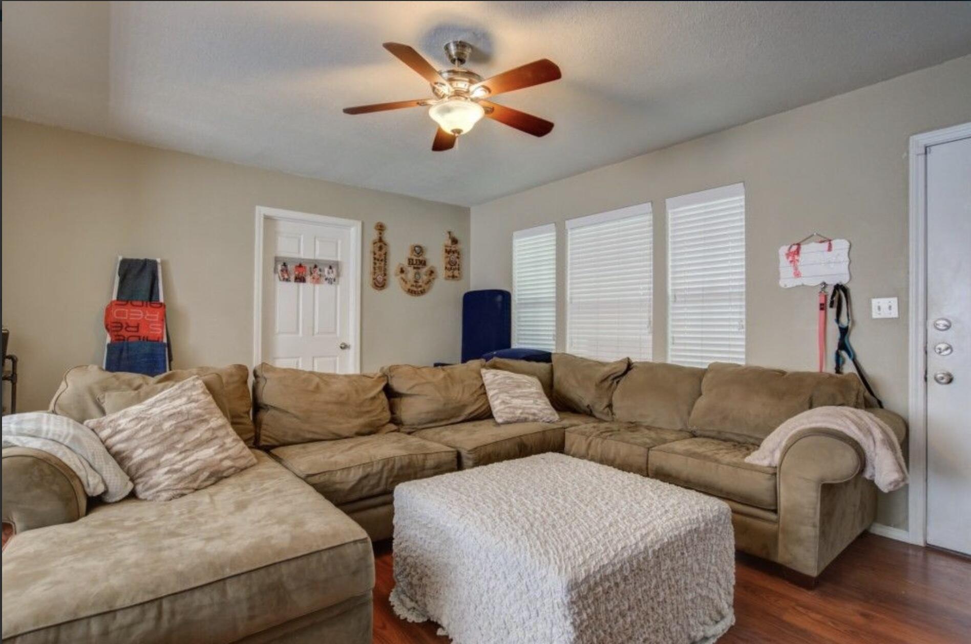 3815 31st Street Lubbock, TX 79410 - Photo 3 of 22 a living room with furniture and a couch