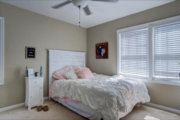 a bedroom with a bed and a cabinets