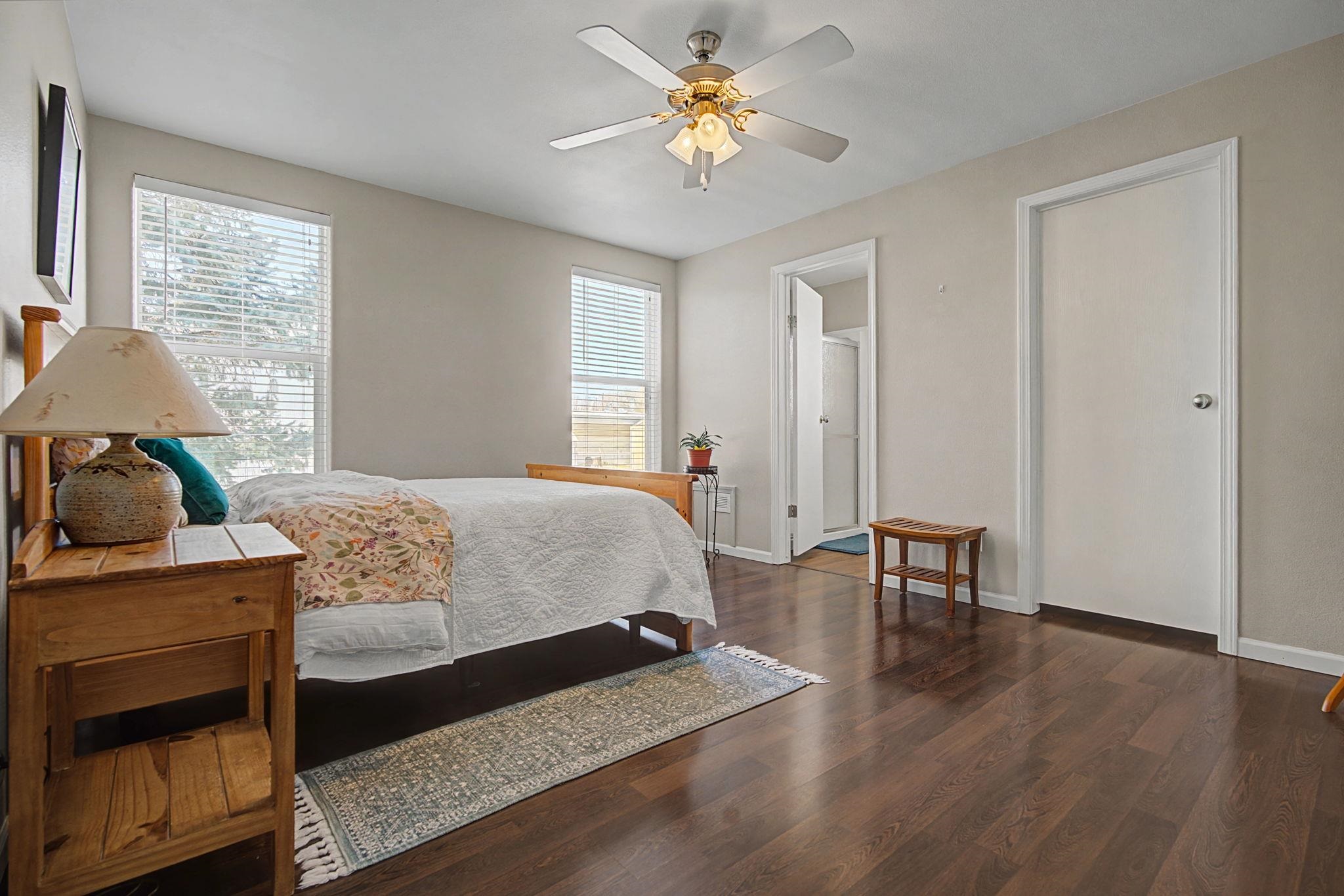 3251 E Road, Unit 72 Clifton, CO 81520 - Photo 12 of 25 a bedroom with a bed and a chandelier