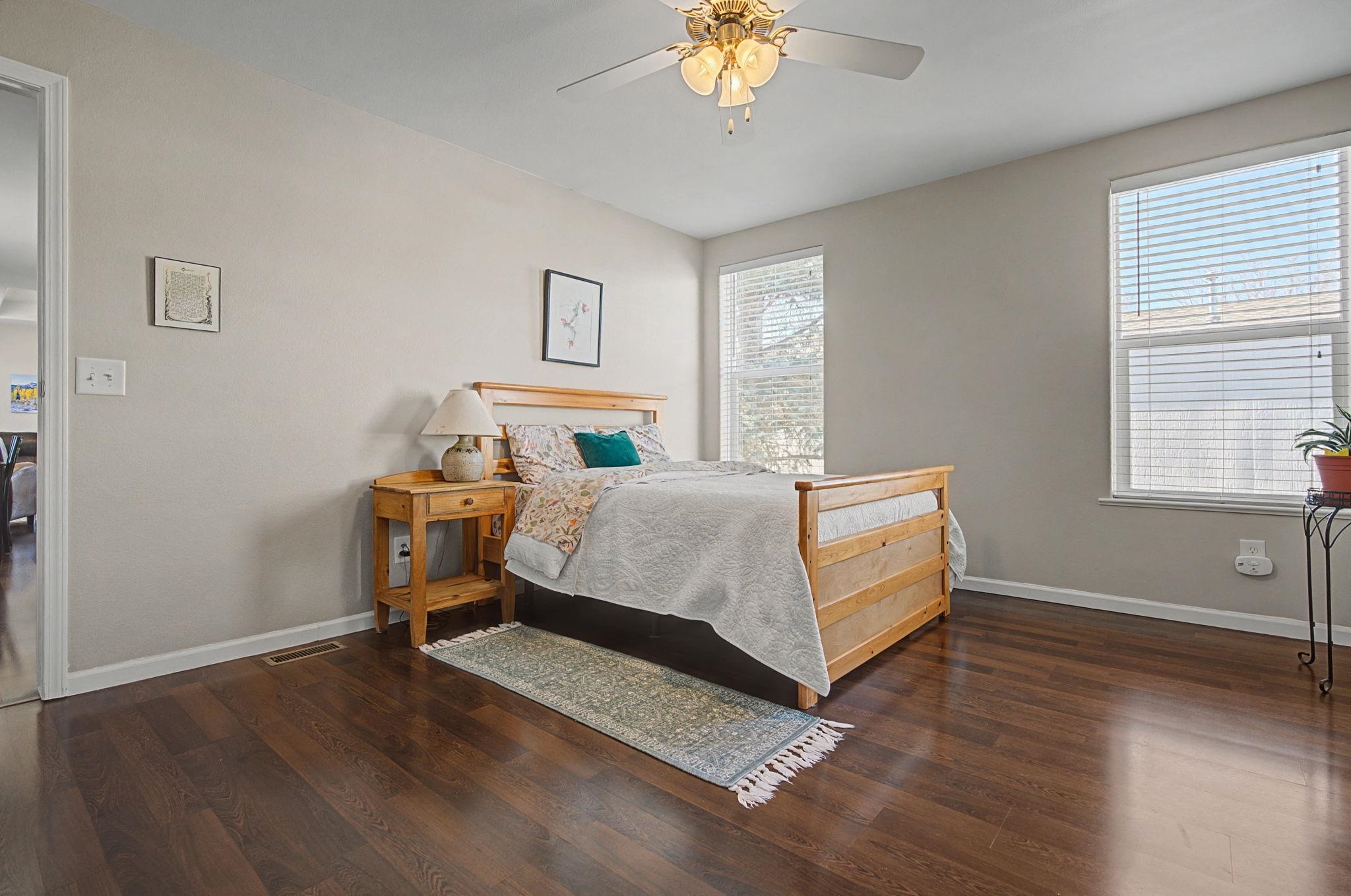 3251 E Road, Unit 72 Clifton, CO 81520 - Photo 13 of 25 a bedroom with a bed and a chandelier