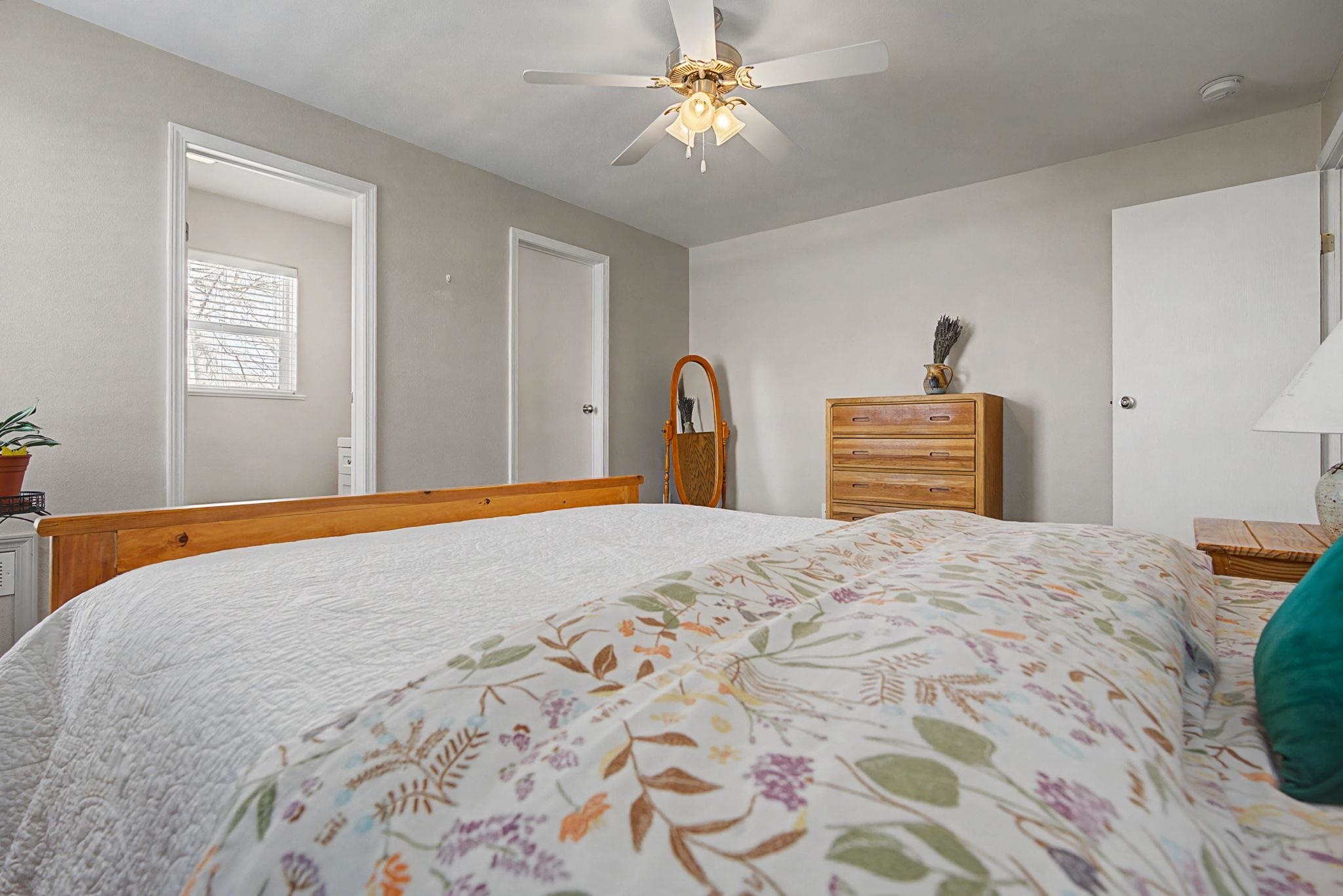 3251 E Road, Unit 72 Clifton, CO 81520 - Photo 14 of 25 a bedroom with bed dresser and a window