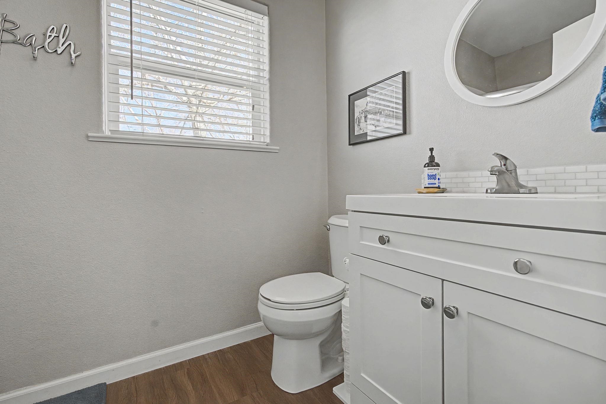 3251 E Road, Unit 72 Clifton, CO 81520 - Photo 15 of 25 a bathroom with a toilet a sink and a mirror