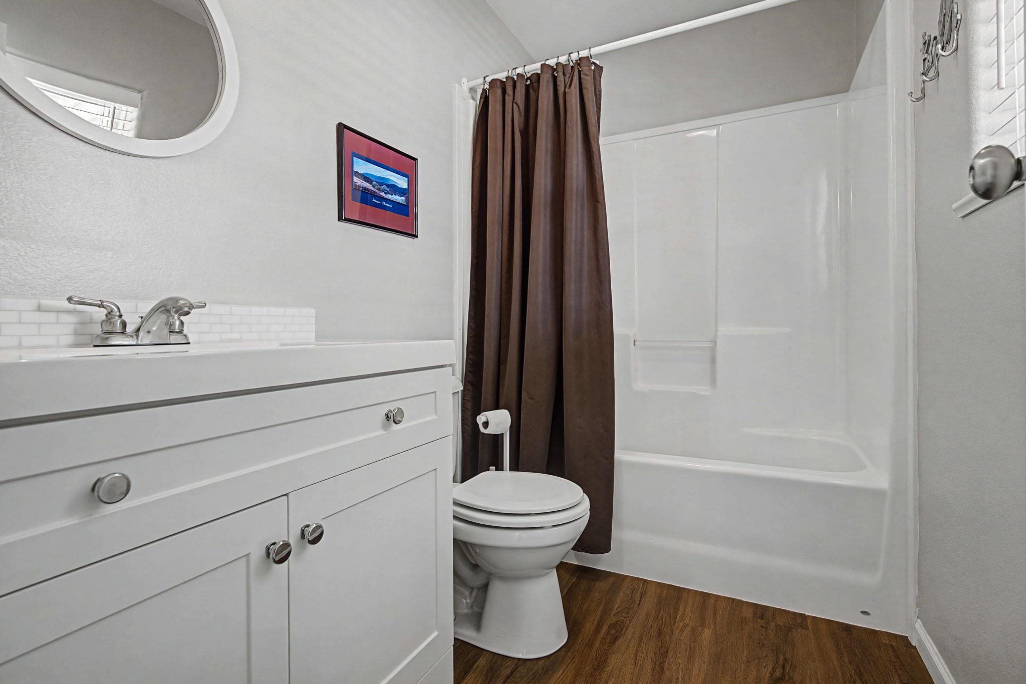 3251 E Road, Unit 72 Clifton, CO 81520 - Photo 19 of 25 a bathroom with a sink a toilet and shower